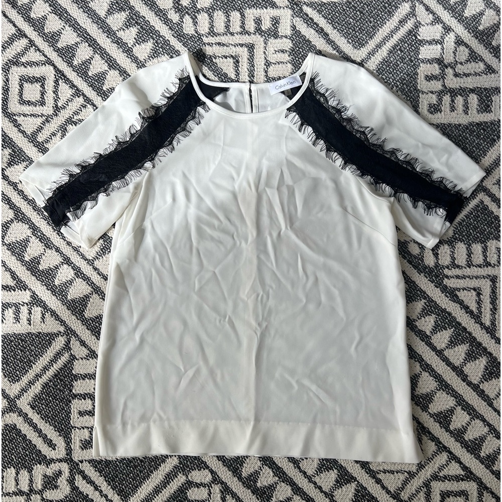 Women’s Calvin Klein dressy blouse for sale. Cream with black lace detail. Small